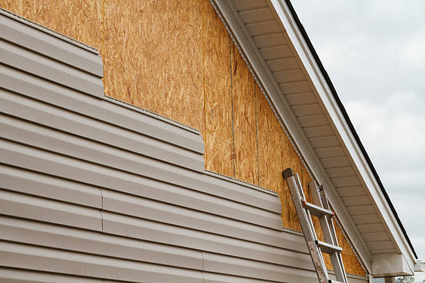 Professional Emergency Siding Repair technician working in Grapeville, PA